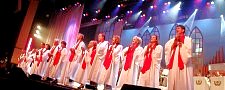 CAST MEMBERS REHEARSE A ROUSING NUMBER...