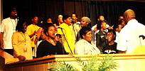 PART OF THE CHOIR AND ENSEMBLE GO THROUGH A NUMBER DURING REHEARSAL...